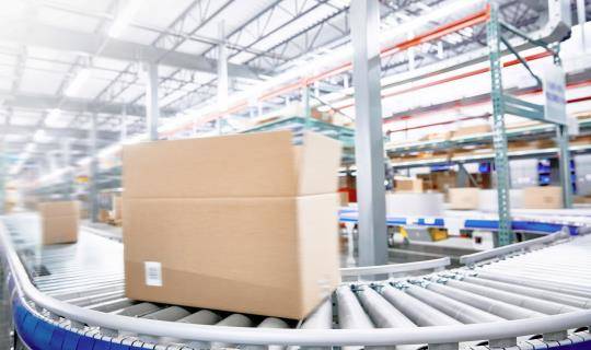 Box on conveyor belt in distribution center