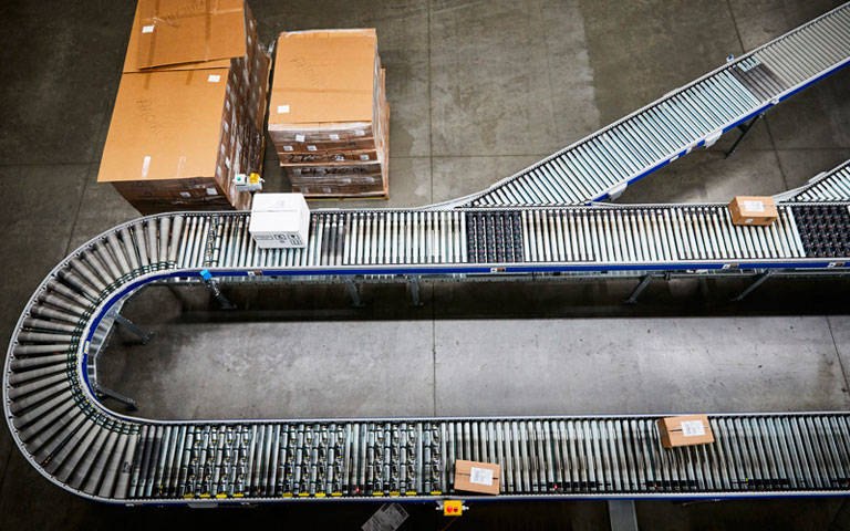 An aerial view of a conveyor belt in a distribution center