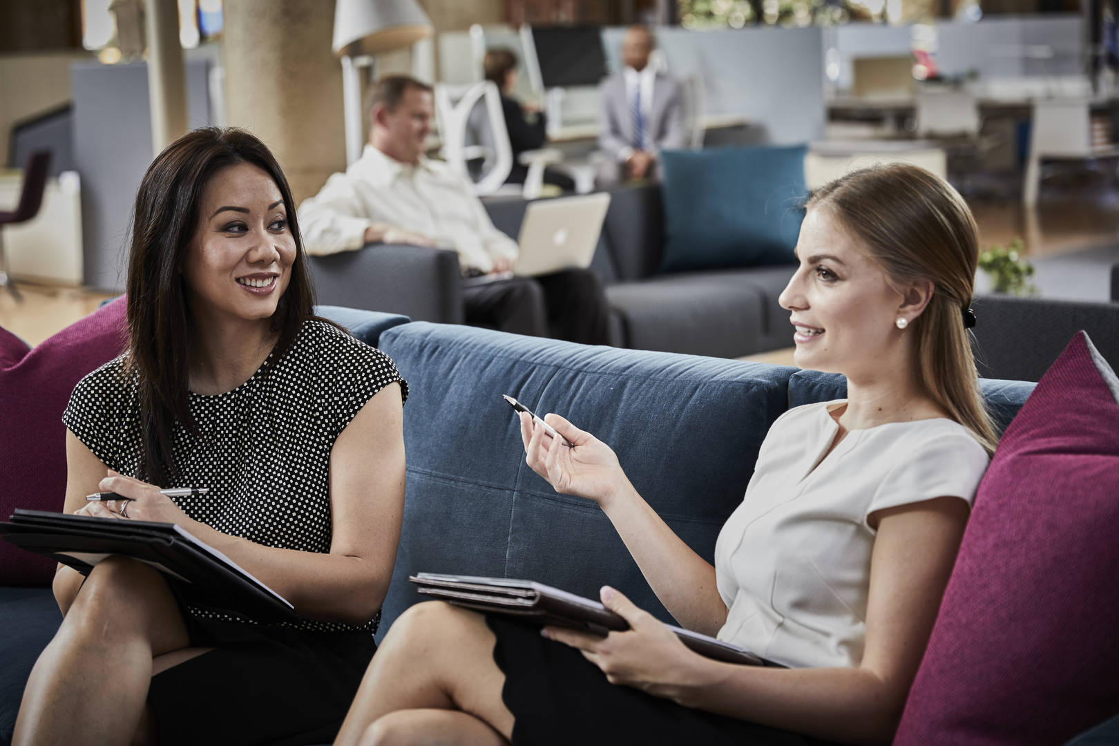 Two women speaking in an office