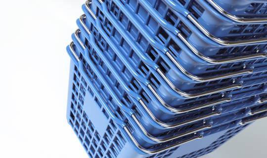 stack of blue shopping baskets