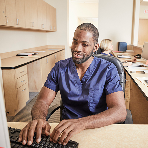 Man using computer in physician practice