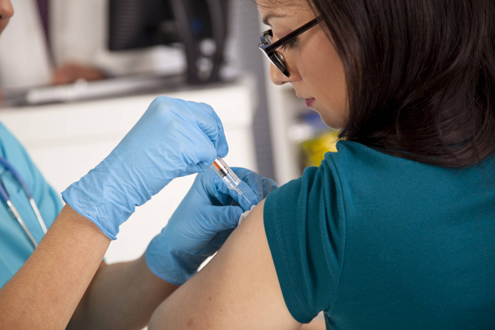 Woman getting vaccine