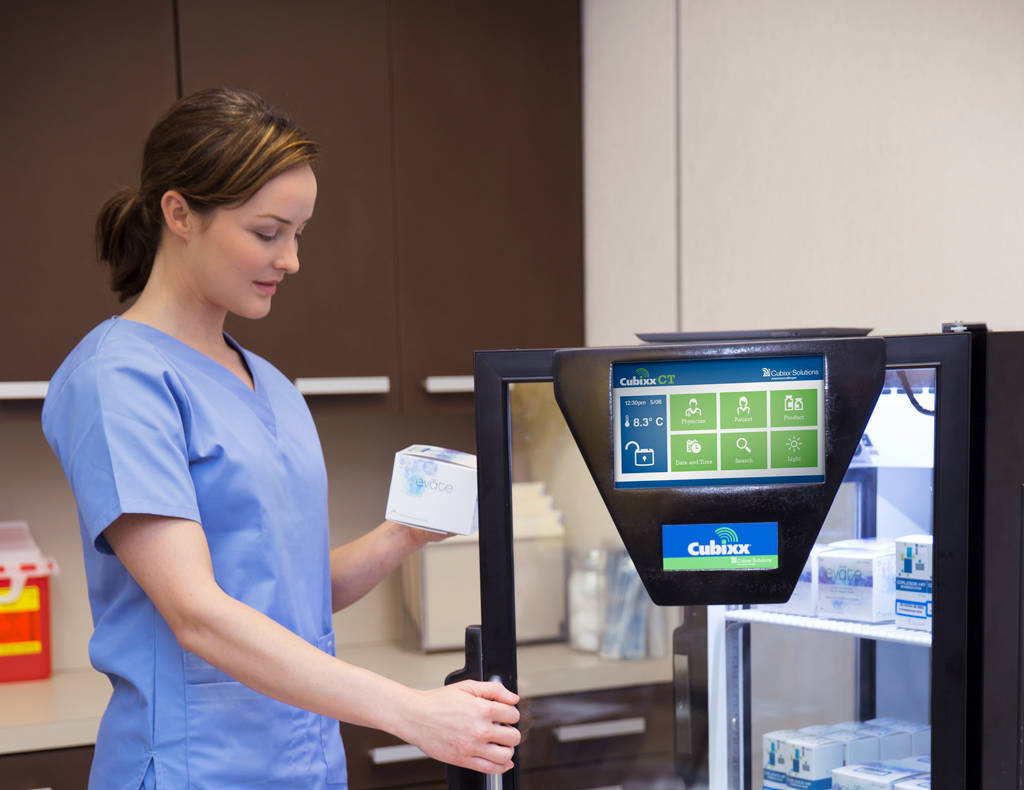 Medical technician accessing medication from CubixxCT