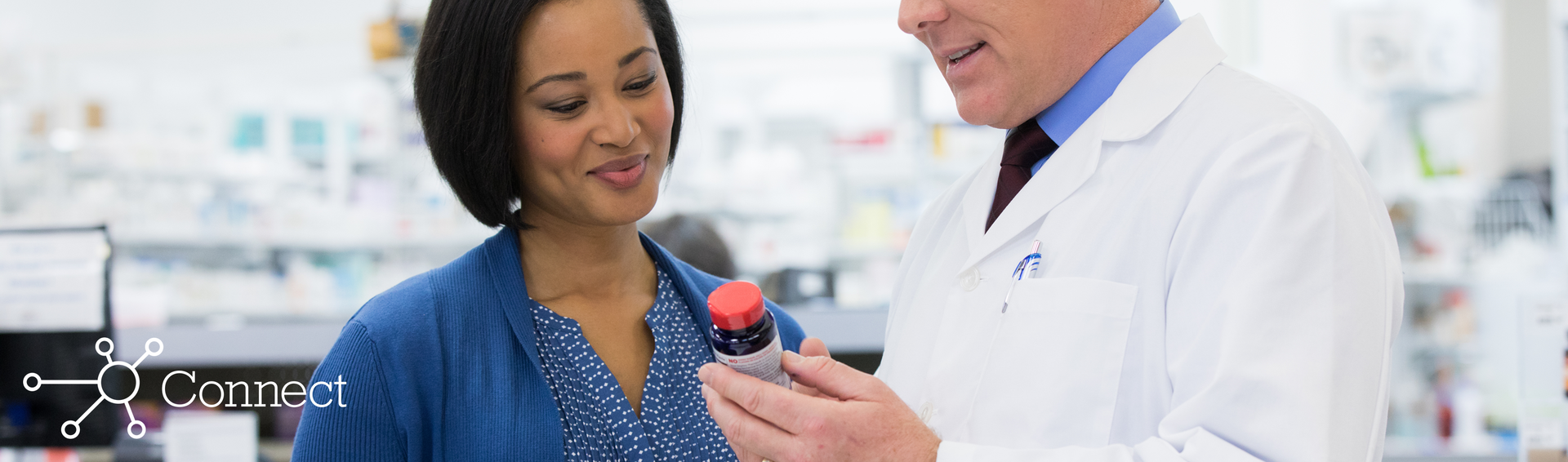 A pharmacist educating a patient on vitamin supplements