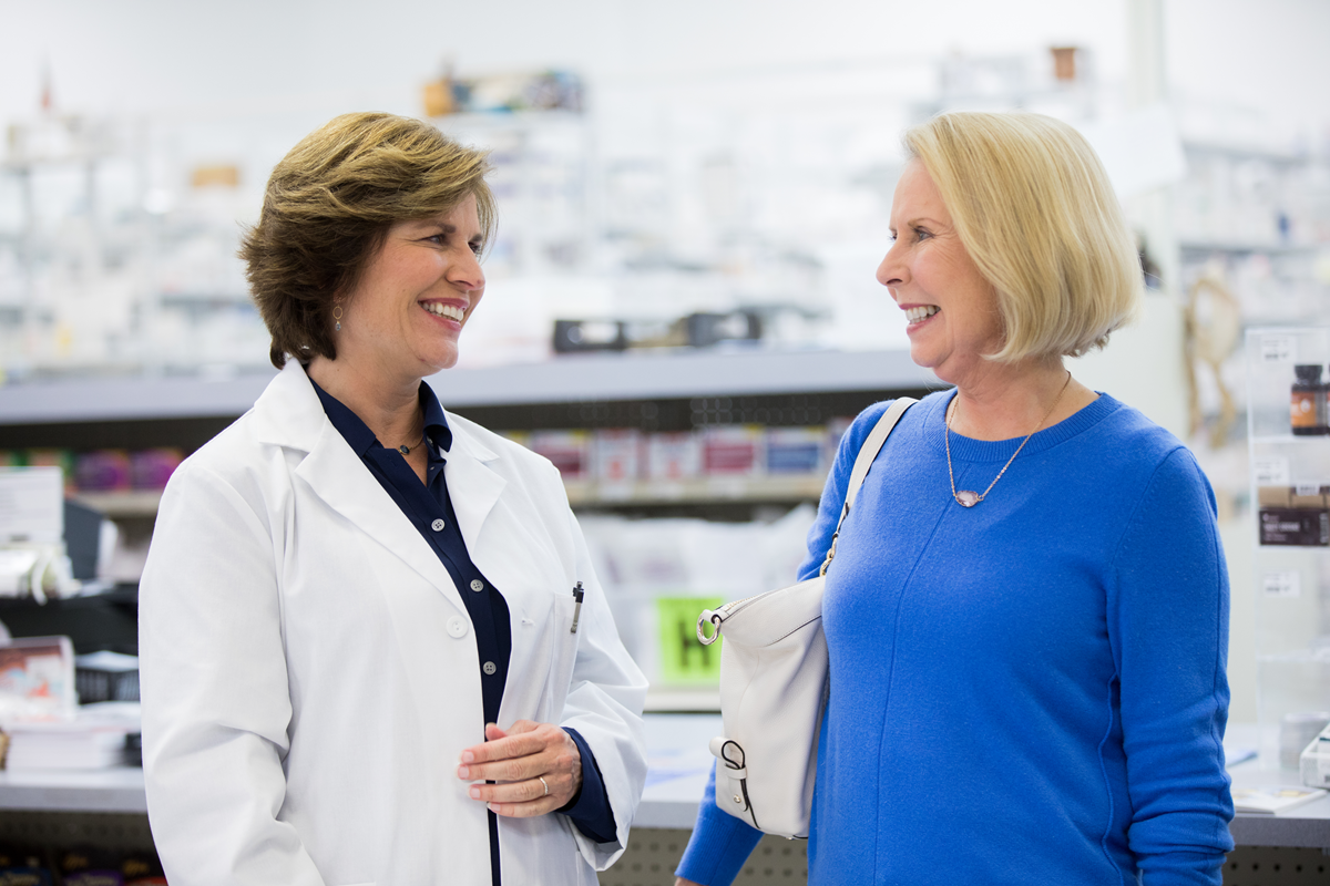 A pharmacist talking to a patient
