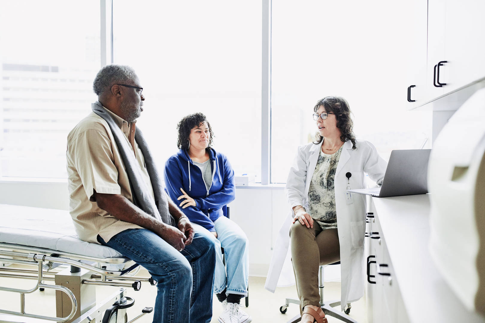 Elderly Black man with community oncology doctor