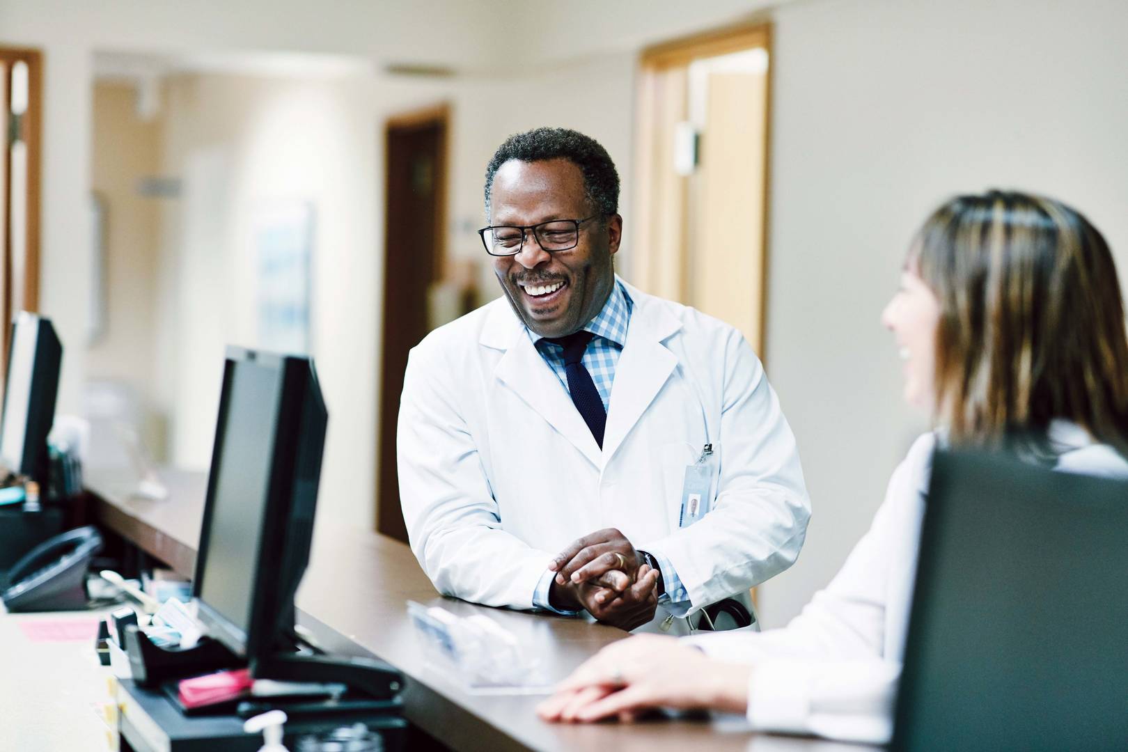 two veterinarians laughing