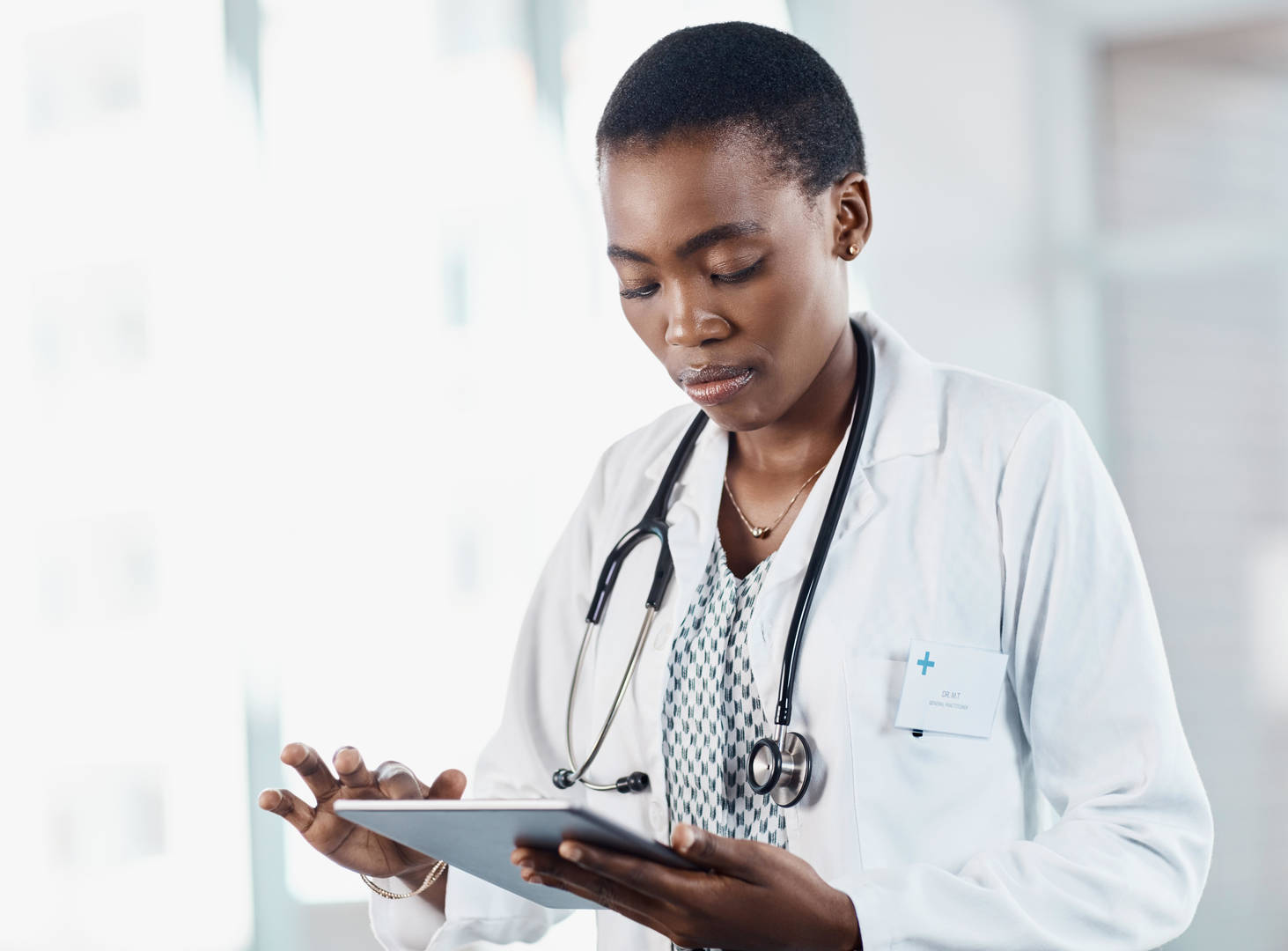 Female veterinarian looking at tablet