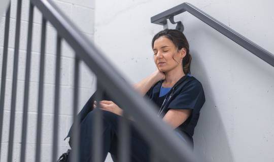 Stressed female veterinarian takes a break