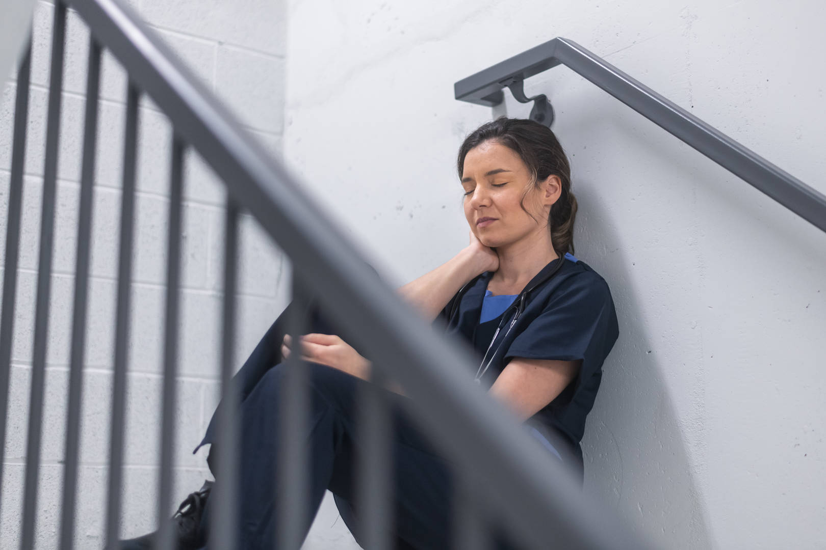 Stressed female veterinarian takes a break