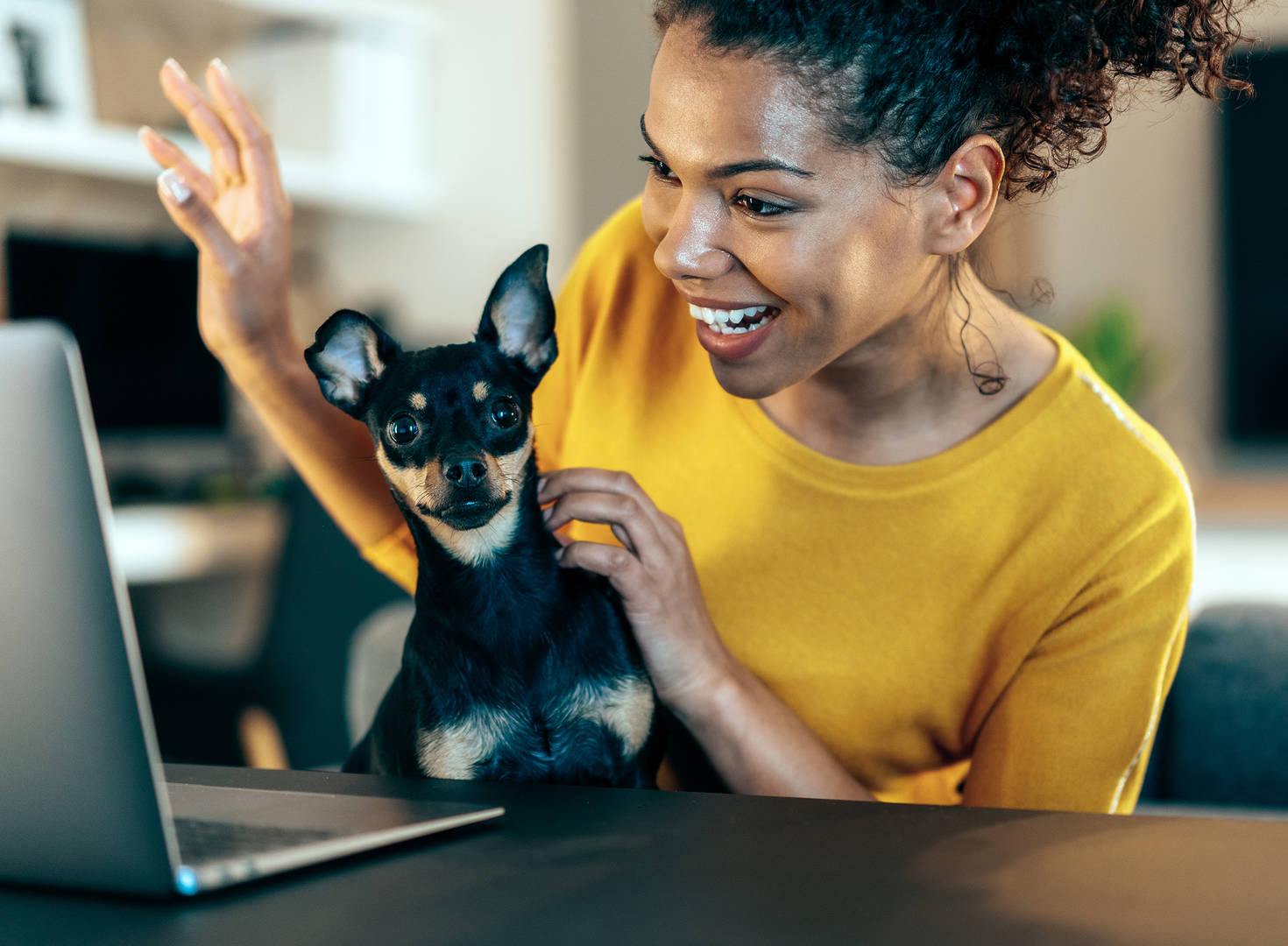 Woman with dog on video call
