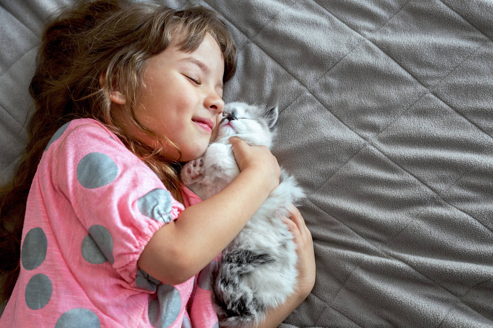 Young girl with kitten