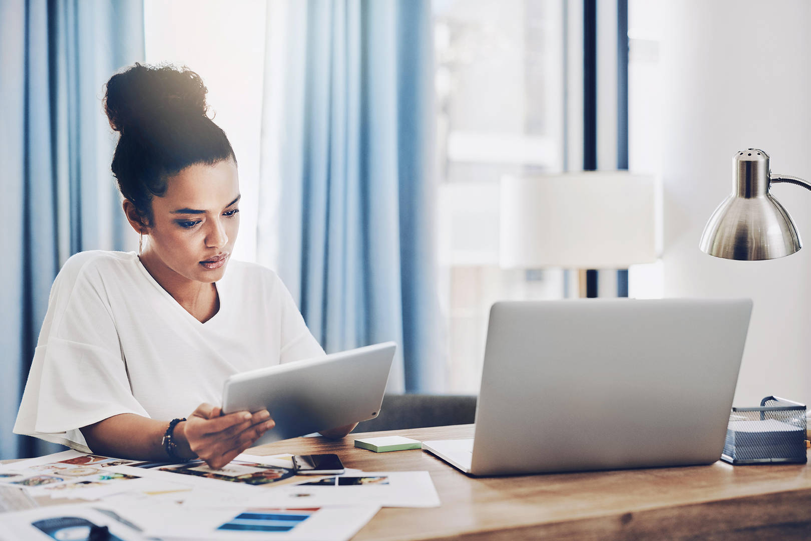 Woman with tablet and computer