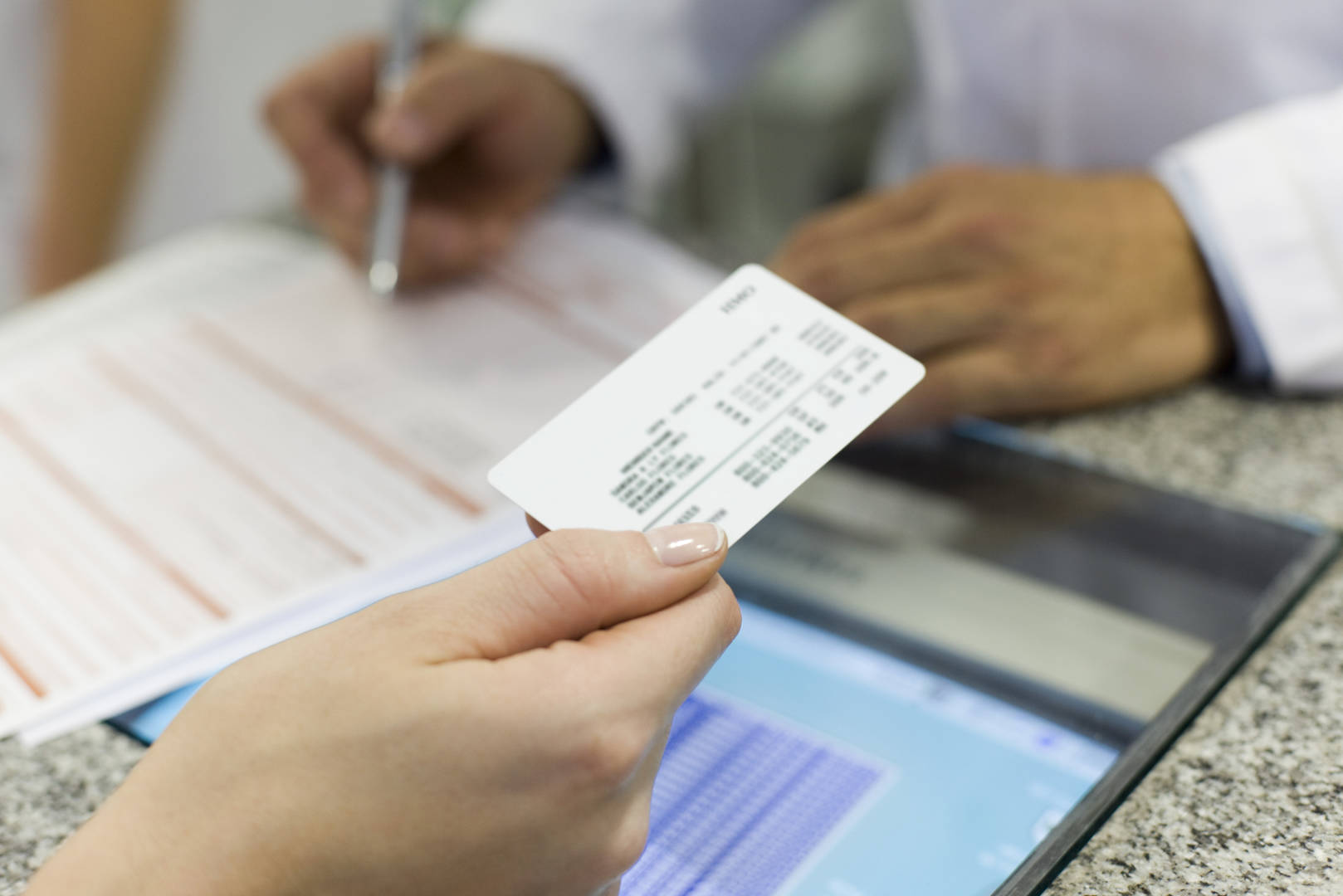 insurance card and tablet