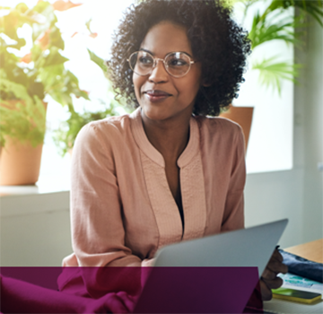 Lady sitting at a desk with a laptop