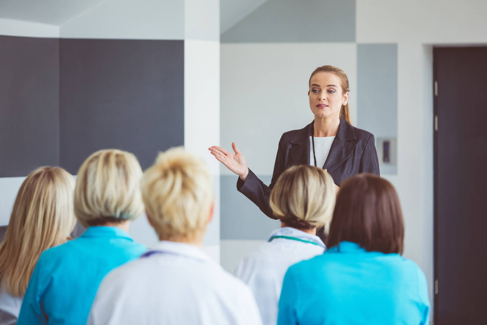 female speaking to medical audience